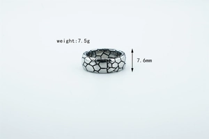 Macro detail of retro square ring with mosaic patterns showing 7.6mm width and 7.5g weight