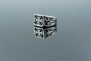 Macro shot of men's square titanium steel ring with black iron cross and side wing carving