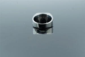Detailed back view of polished silver stainless steel men's ring on reflective surface