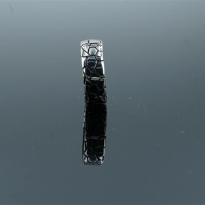 Vintage silver metal square ring with geometric cracked texture on black mirror surface