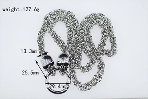 Detailed view of punk silver skull necklace with Byzantine chain and dimensions displayed