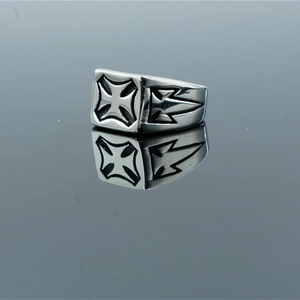 Punk style stainless steel men's ring featuring engraved iron cross on a reflective surface