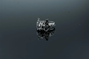 Detailed close-up of retro dragon head ring with intricate scales and vintage finish