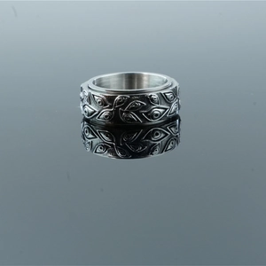 Rotating vintage punk spinner ring with embossed eye patterns in antique silver finish