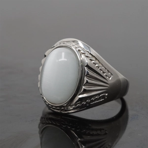 Vintage stainless steel ring with oval white cat eye stone and textured retro band design