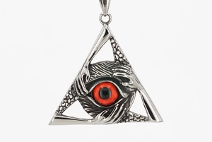 Macro detail of gothic triangle pendant with eye symbol and dragon scale texture