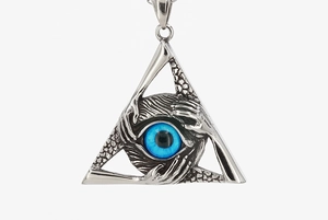 Macro shot of gothic triangle pendant with four hands gripping a vibrant blue eye