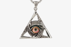 Macro shot of silver metal dragon claw triangle pendant with realistic colorful eye