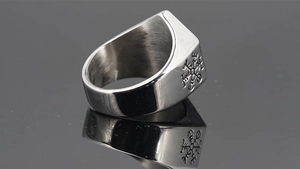 Macro detail of a vintage Viking tree of life signet ring with Nordic rune engravings