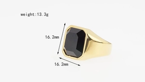Close-up of men's gold stainless steel signet ring with a faceted rectangular black gemstone