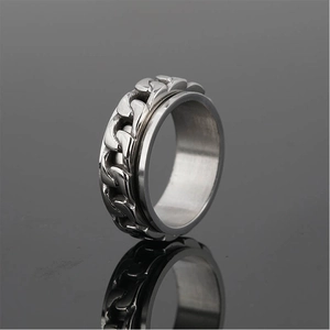 Polished stainless steel spinner ring with a rotating cuban link chain inlay for men