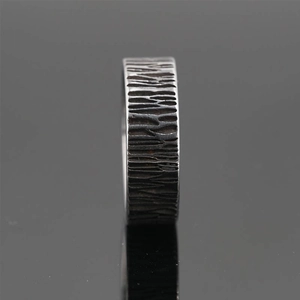 Vintage textured stainless steel wide ring with rustic bark pattern and oxidized finish