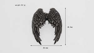 Macro detail of angel wing pendant with 25.1g weight and 48.3mm height parameters