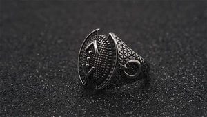 Detailed macro view of retro punk steel ring with crescent moon and star patterns