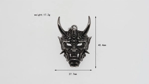 Detailed view of Prajna mask pendant with dimensions of 40.4mm height and 17.2g weight
