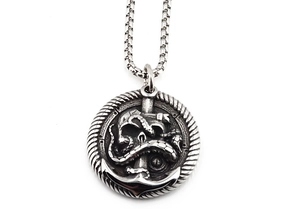 Detailed view of a vintage silver pirate anchor skull pendant on a stainless steel box chain