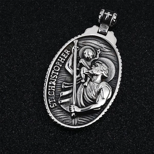 Vintage St. Christopher oval pendant necklace with religious saint relief and cross bail