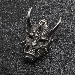 Gothic Hannya mask pendant in distressed silver titanium steel with intricate demon carving