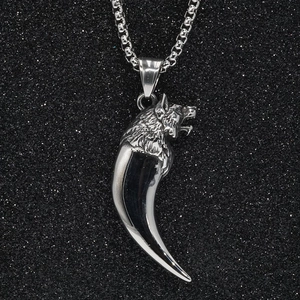 Men's silver wolf tooth pendant necklace in stainless steel on black background