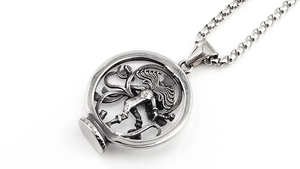 Macro shot of Medusa pendant detail with vintage oxidized finish on steel square chain
