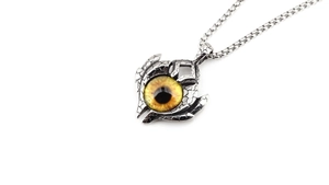Detailed close-up of retro silver dragon claw necklace featuring a realistic amber evil eye
