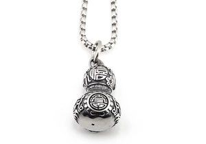 Macro detail of silver vintage Wu Lou pendant necklace featuring Fu character and patterns