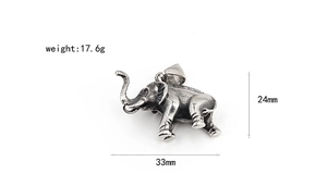 Macro detail of vintage titanium steel elephant pendant showing size and weight specs