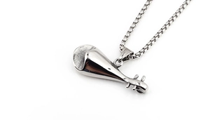 Detailed macro view of silver-toned stainless steel pipa pendant necklace with box chain
