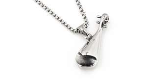 Detailed close-up of a silver lute pendant necklace with intricate musical textures