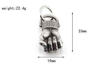 Detail view of retro titanium steel fist pendant with weight and size dimensions