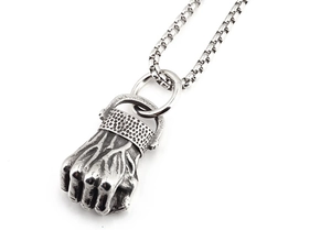 Detailed close-up of retro punk fist pendant in titanium steel with intricate textures