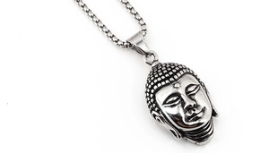Macro shot of Buddha head pendant featuring vintage finish and square pearl chain