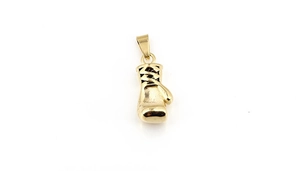 Detailed close-up of golden boxing glove pendant with polished mirror finish texture
