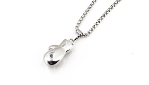 Detailed view of silver boxing glove pendant with polished mirror finish on steel chain