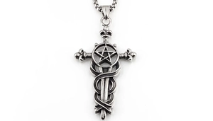Macro view of vintage stainless steel sword cross pendant with snake wrap detail