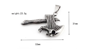Macro view of stainless steel axe pendant with skull engraving and vintage texture