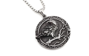 Detail of Viking crow pendant with embossed dead branches and vintage steel box chain