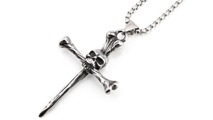Detail view of retro skull and sword pendant on a sturdy steel box chain