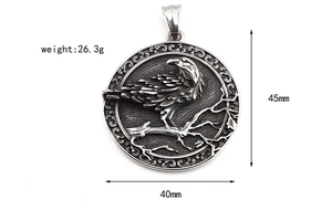Detailed view of Viking crow pendant with embossed dead wood design on stainless steel