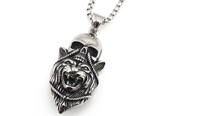 Detailed view of the gothic wolf head and skull pendant with vintage silver finish