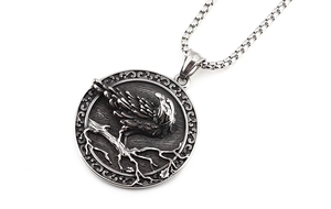 Close-up of Viking raven relief pendant on oxidized stainless steel chain necklace