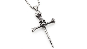 Macro detail of gothic skull and crossbones pendant with oxidized finish box chain