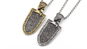 Detailed macro of vintage Pharaoh necklaces in gold and silver with black zircon pavé