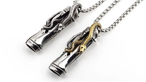 Detailed view of punk snake engraved cylinder pendants in silver and two-tone finishes