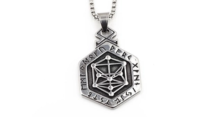 Macro shot of hexagonal stainless steel pendant featuring Nordic runes and cube pattern