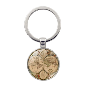 Detailed macro view of vintage world map glass dome pendant on polished metal keychain