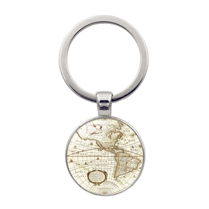 Detail view of a vintage world map keychain featuring a polished silver metal ring and glass dome