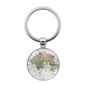 Close-up of vintage world map glass pendant with silver metal ring and retro globe design