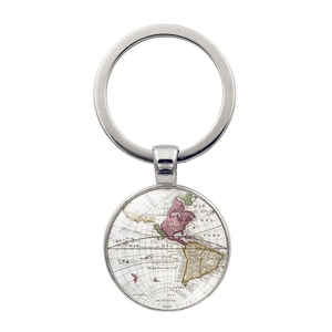 Detail of vintage world map pendant with polished silver key ring showing South America
