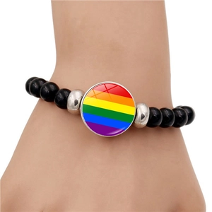 Rainbow stripe beaded bracelet with black beads and silver spacers on white background